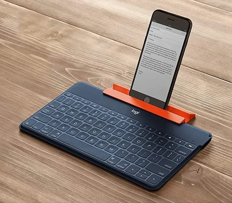 Taper avec un grand clavier physique sur iPhone