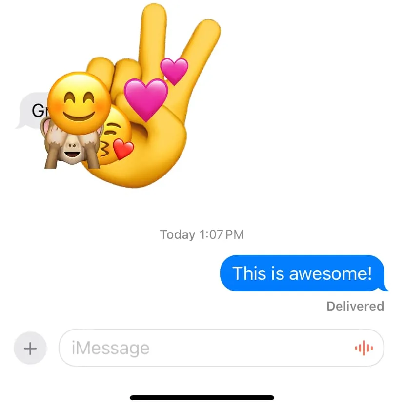 Five emoji reactions over one message on iPhone