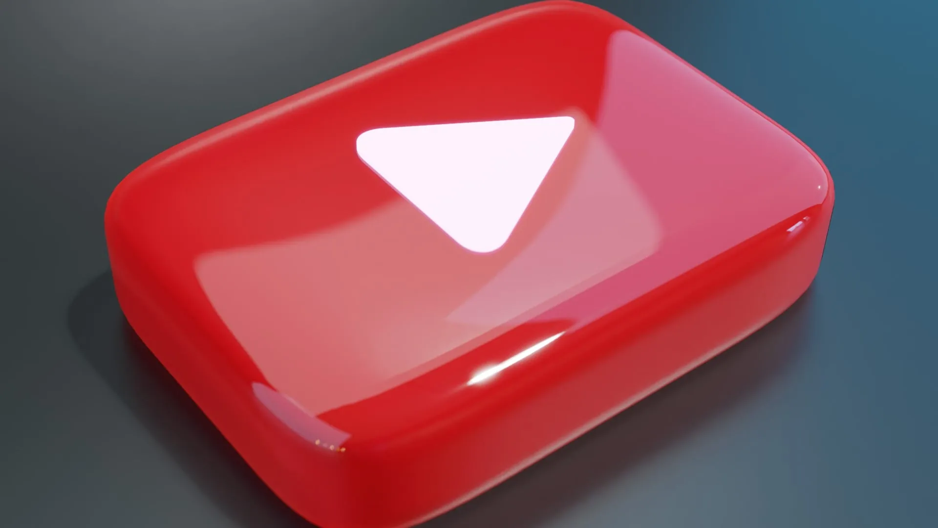 흰색 재생 기호가 있는 YouTube 빨간색 버튼의 광택 렌더링