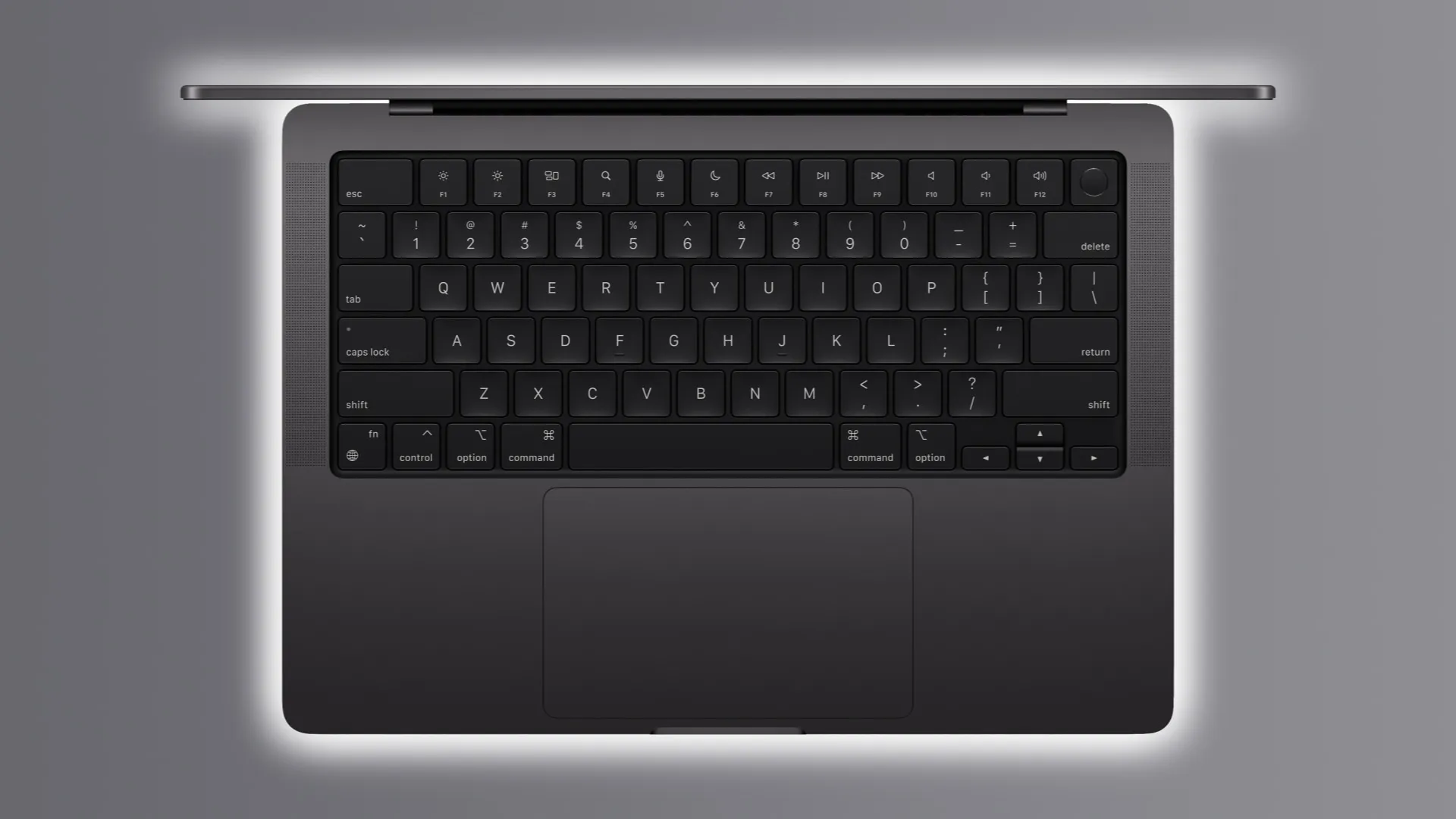 深空灰色 M3 MacBook Pro 打開蓋子，展示背光鍵盤