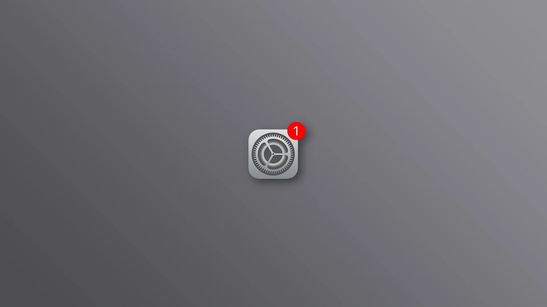 El ícono de Configuración del iPhone con una insignia roja, sobre un fondo gris