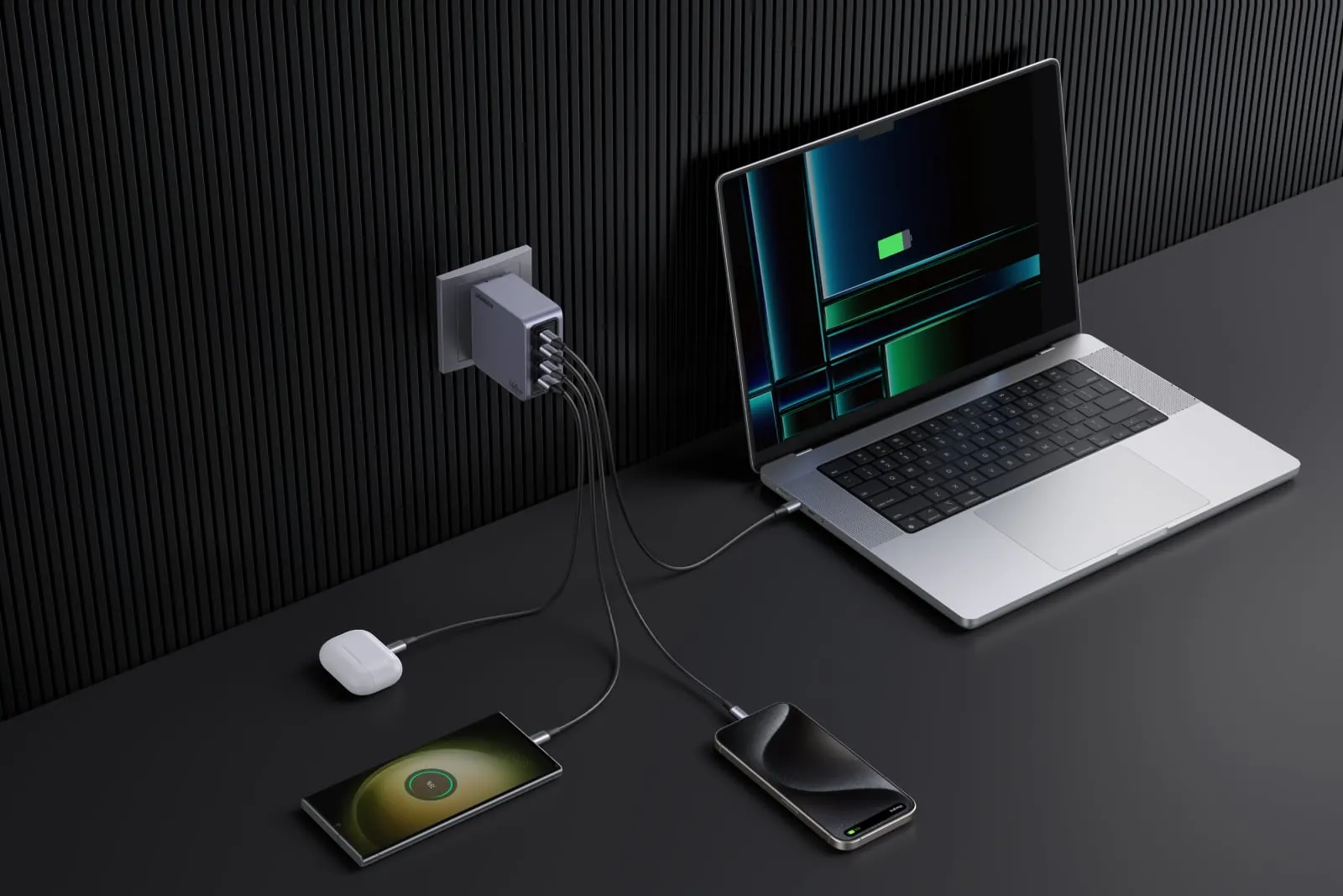 Cargador Ugreen Nexode Pro conectado a la pared, alimentando MacBook Pro, iPhone, AirPods y teléfonos Android
