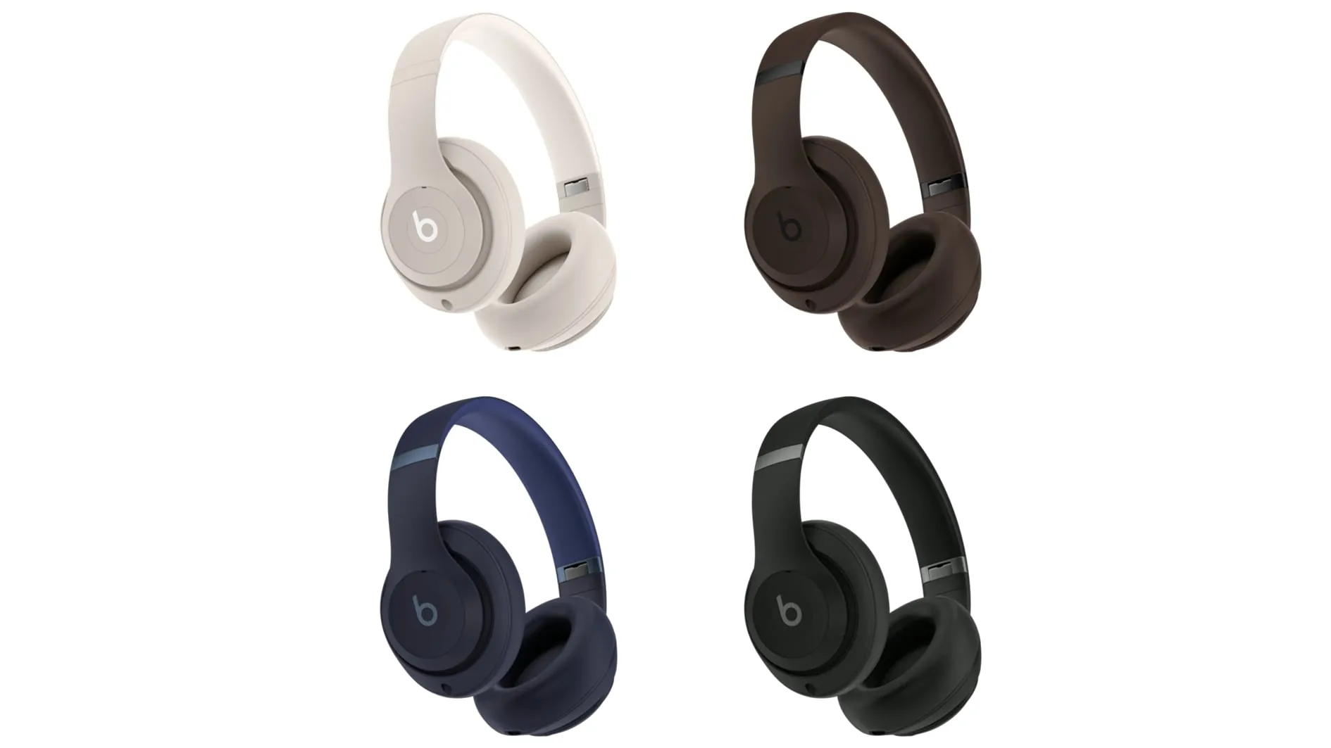 Four Beats Studio Pro over-ear-hörlurar i vitt, brunt, mörkblått och svart, mot en vit bakgrund